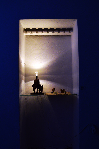 blue light alter with animal figures sculpture