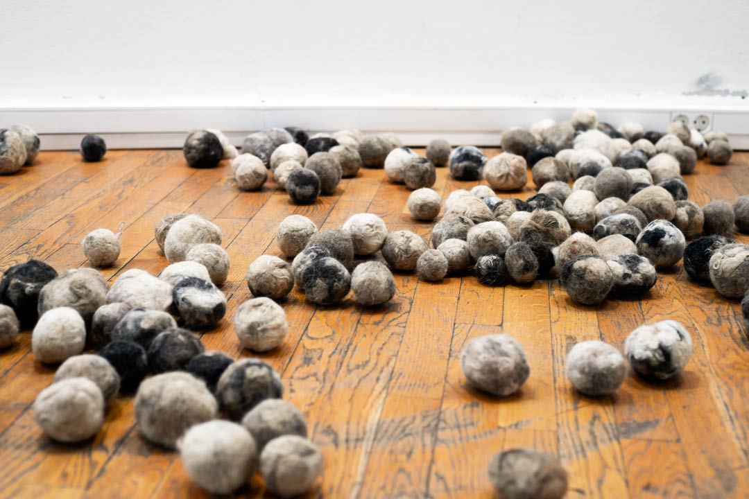 balls from dog hair in art gallery