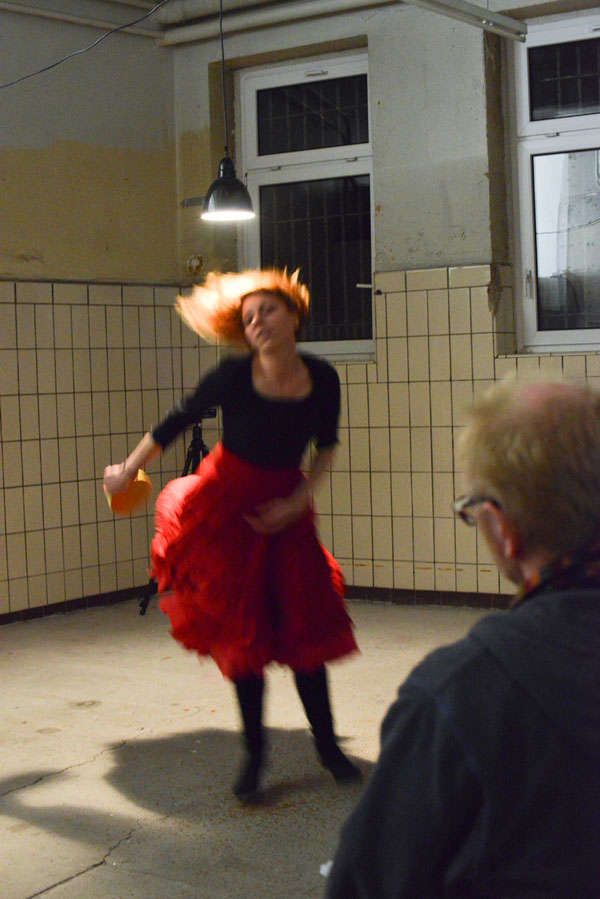 woman in red dress dancing